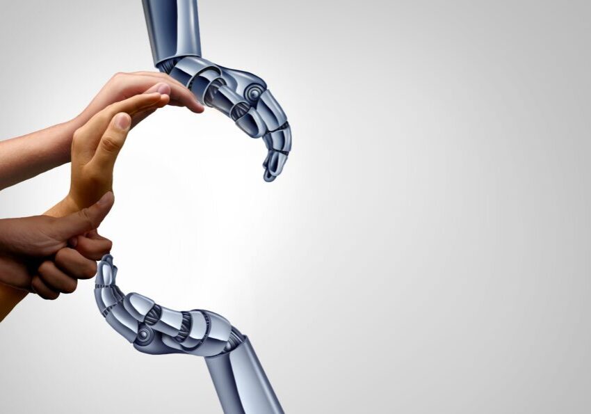 Human and robotic hands forming circle.